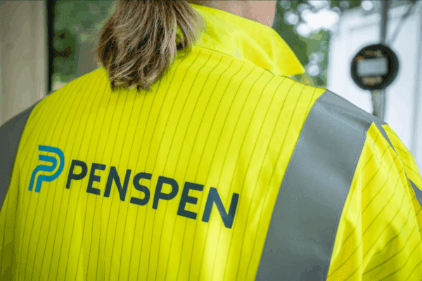 A female Penspen employee wearing branded coveralls