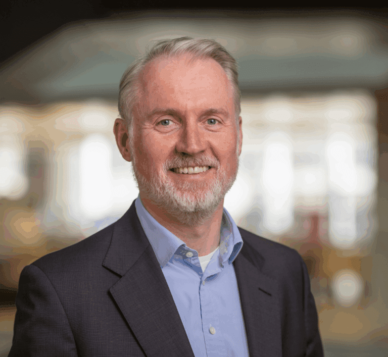 Image of male wearing suit smiling at camera