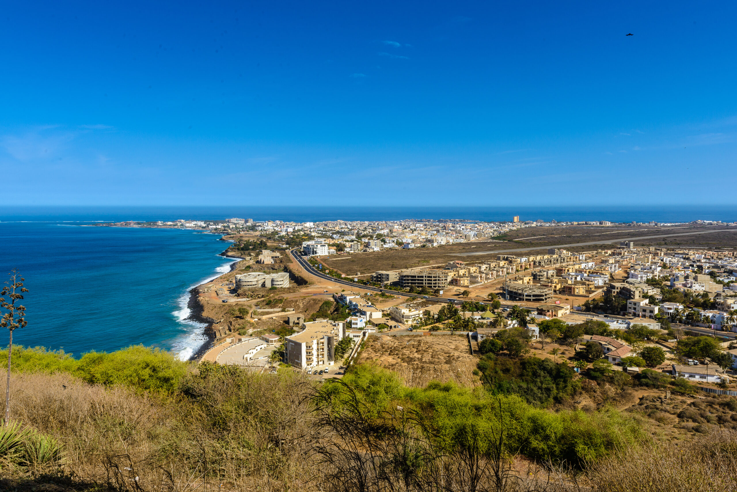 A panoramic image of Dakar, Senegal, showing blue skies and the coast