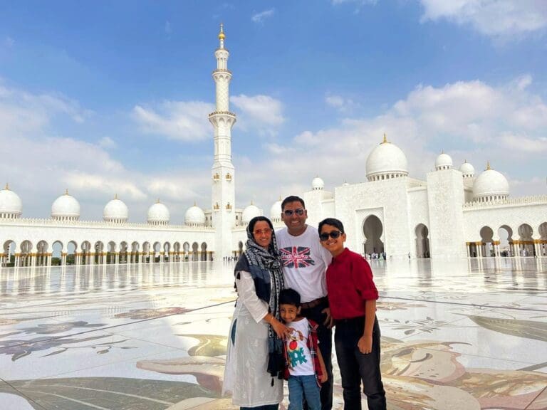 A family stands in from of the Grand Mosque in Abu Dhabi. The man in the photo is Nilesh Kakade, Principal Mechanical Engineer at Penspen
